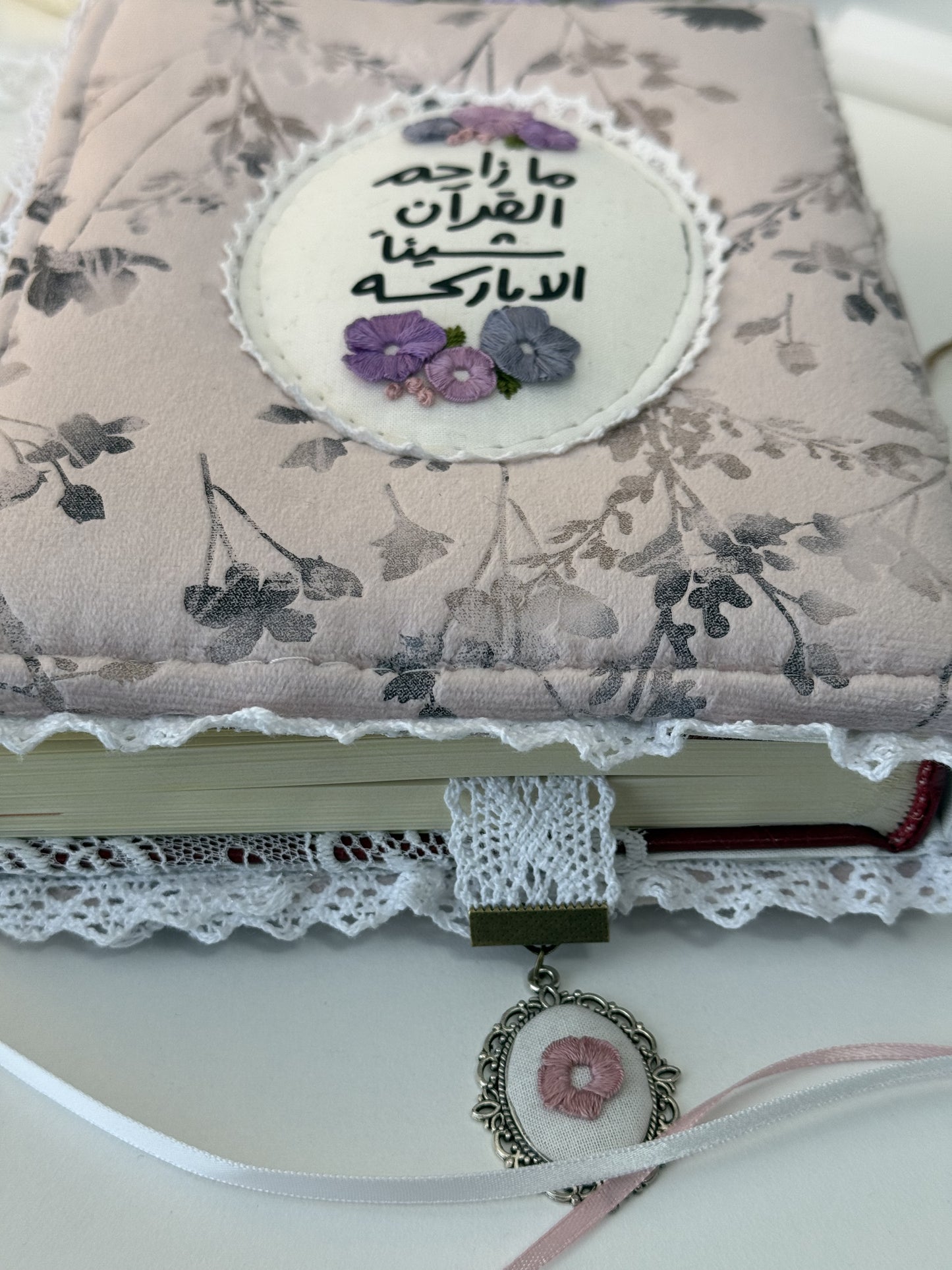 purple floral hardcover Qurān cover