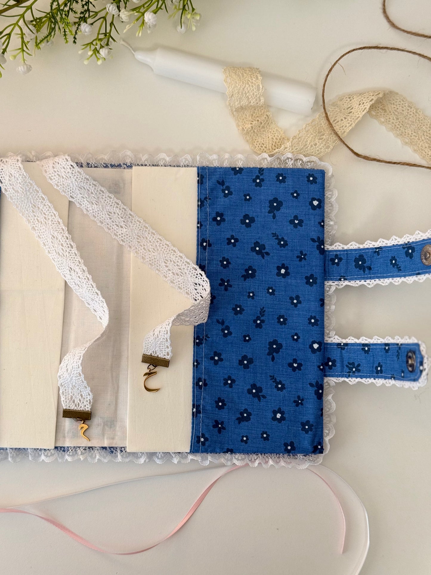 blue floral hardcover Qurān cover