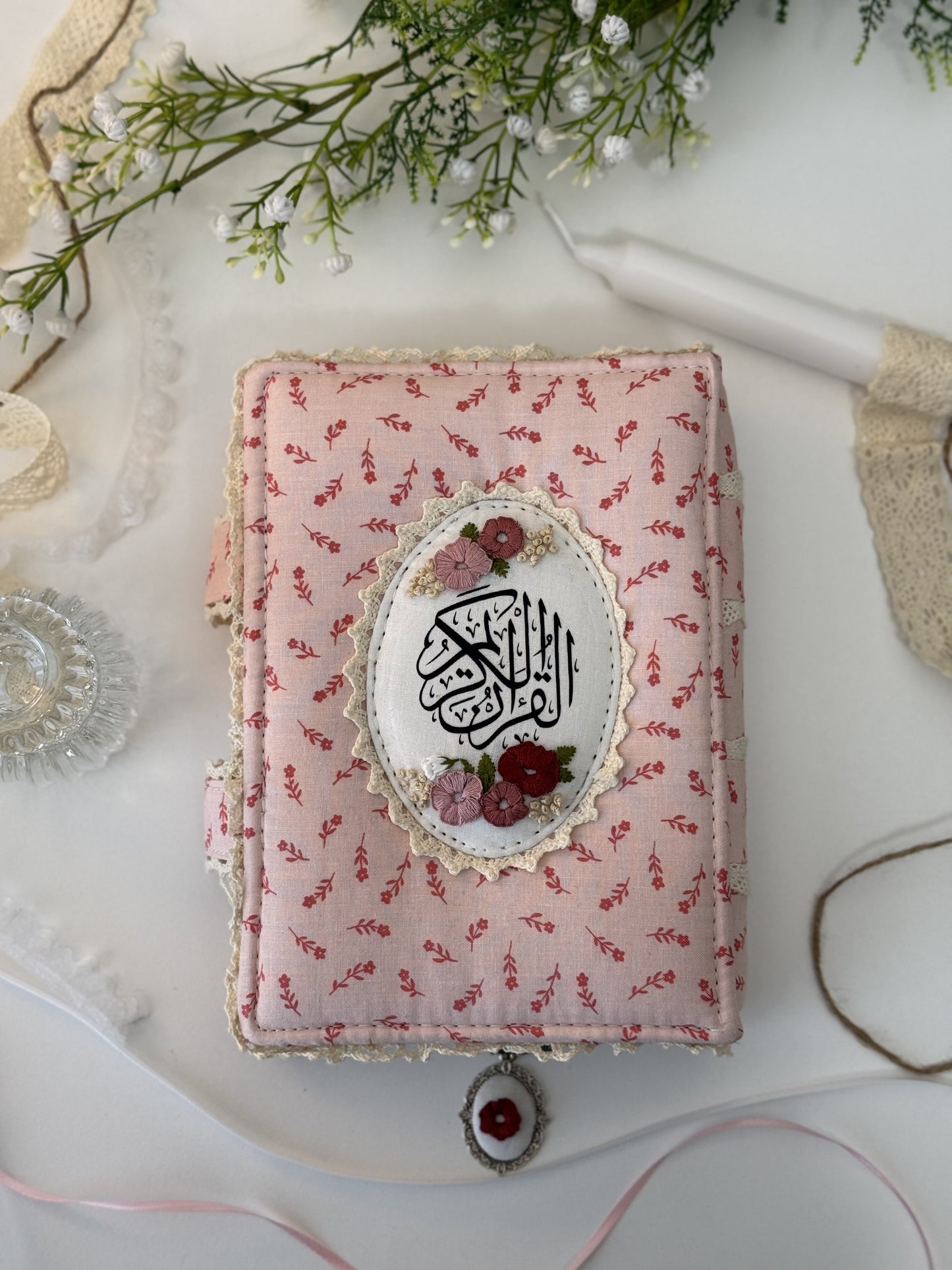 pink floral hardcover Qurān cover