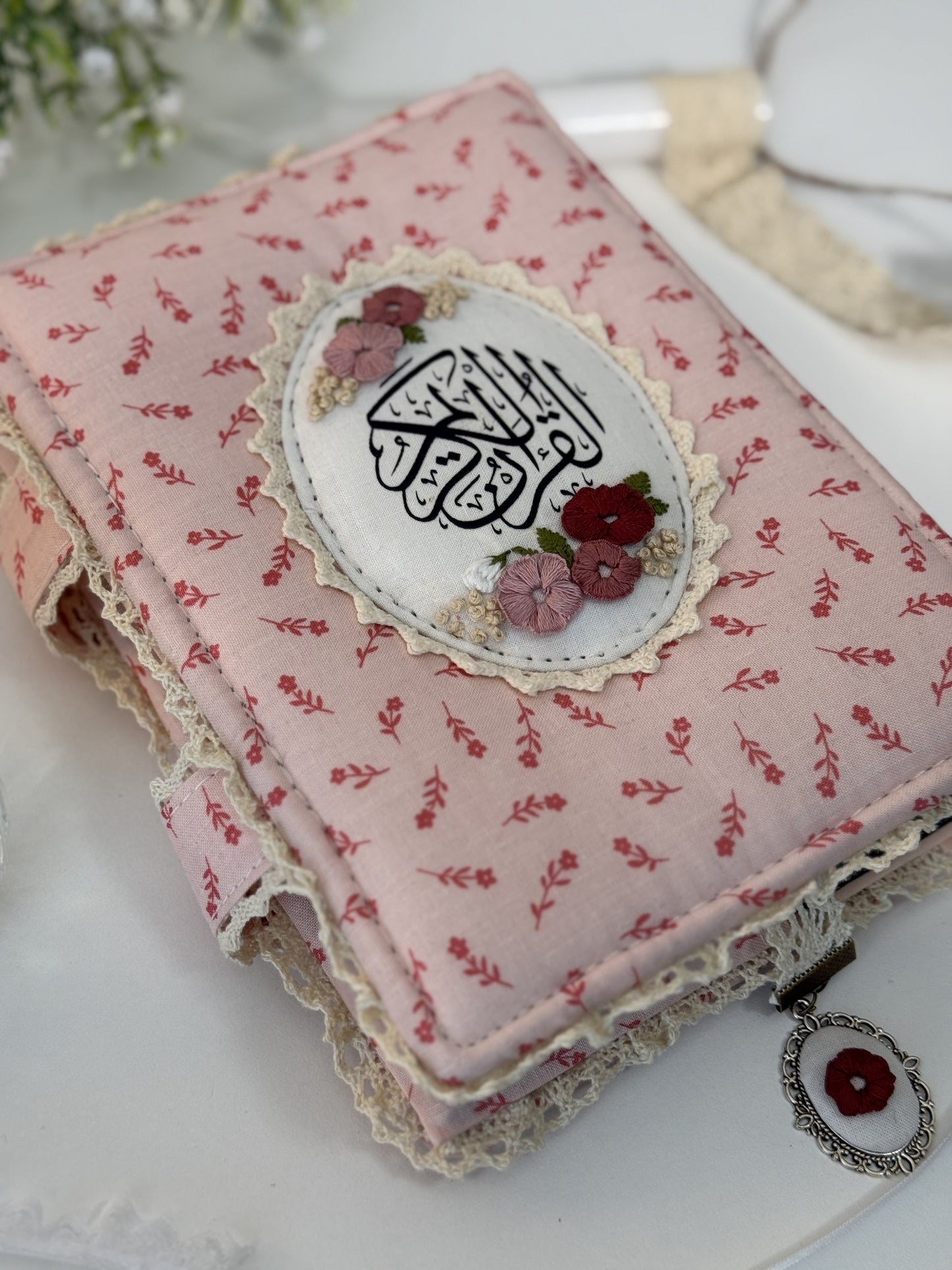 pink floral hardcover Qurān cover