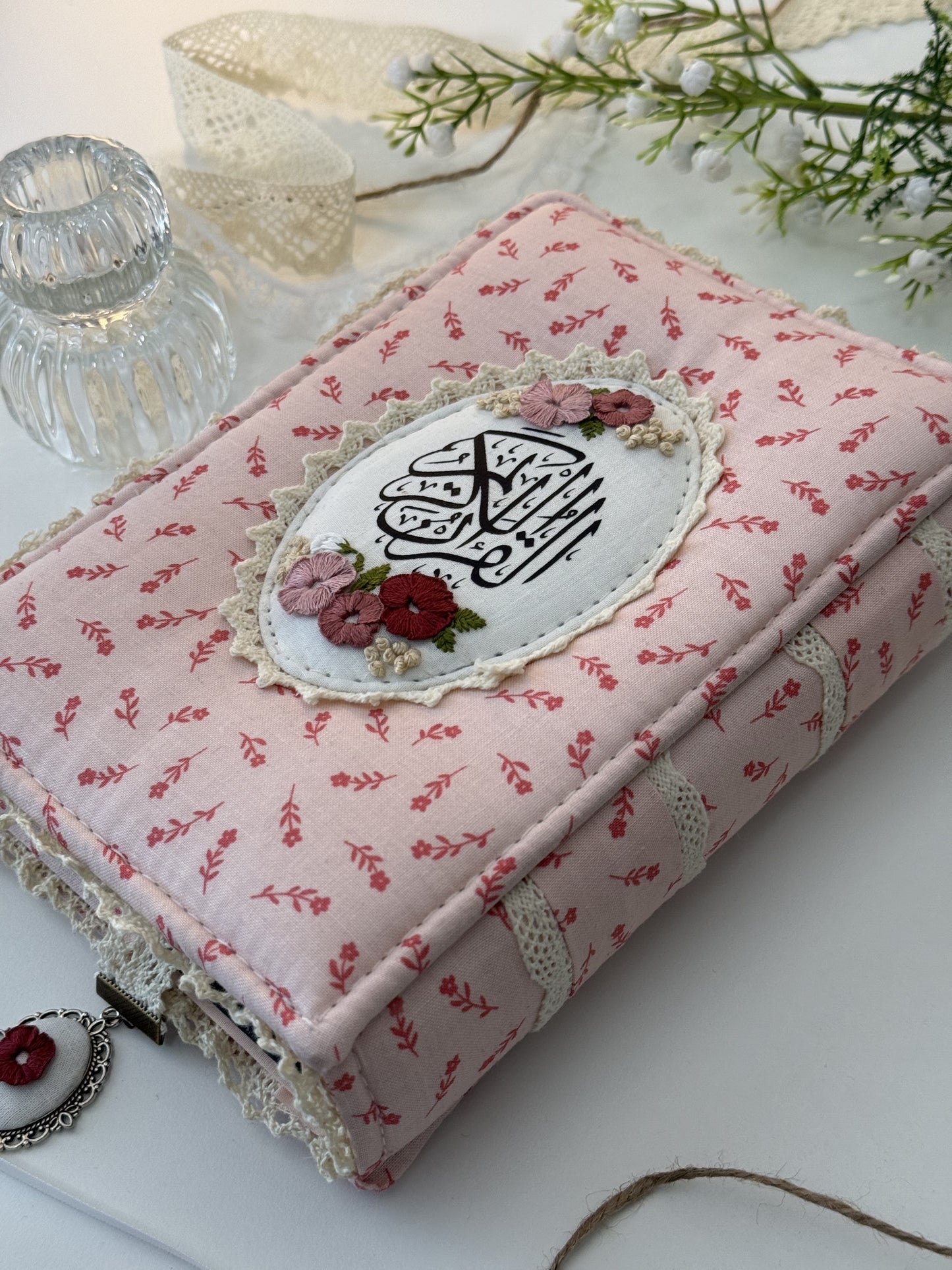 pink floral hardcover Qurān cover