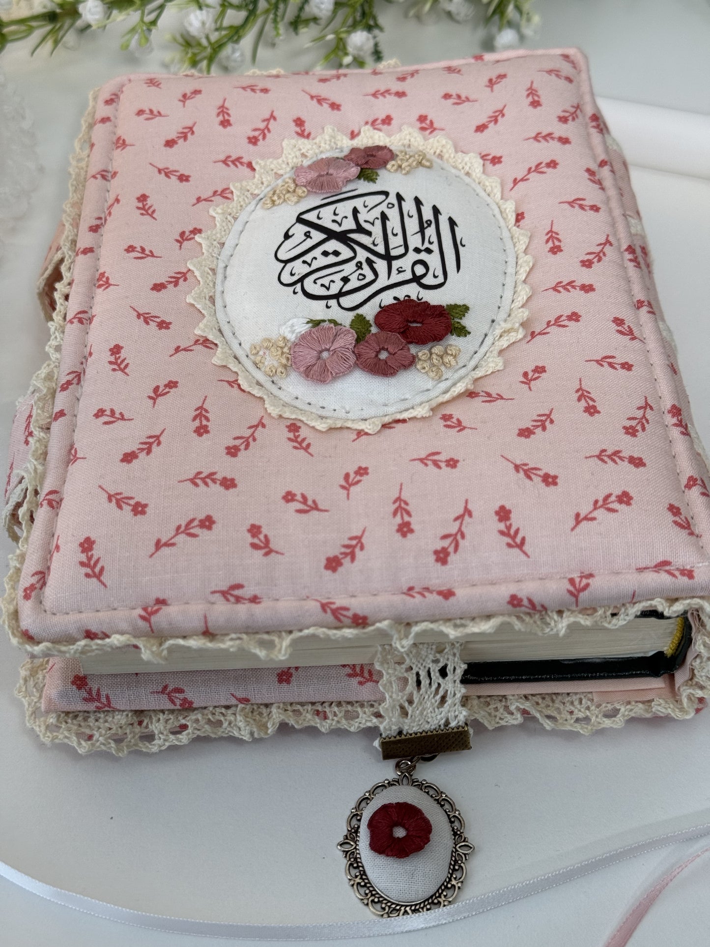 pink floral hardcover Qurān cover