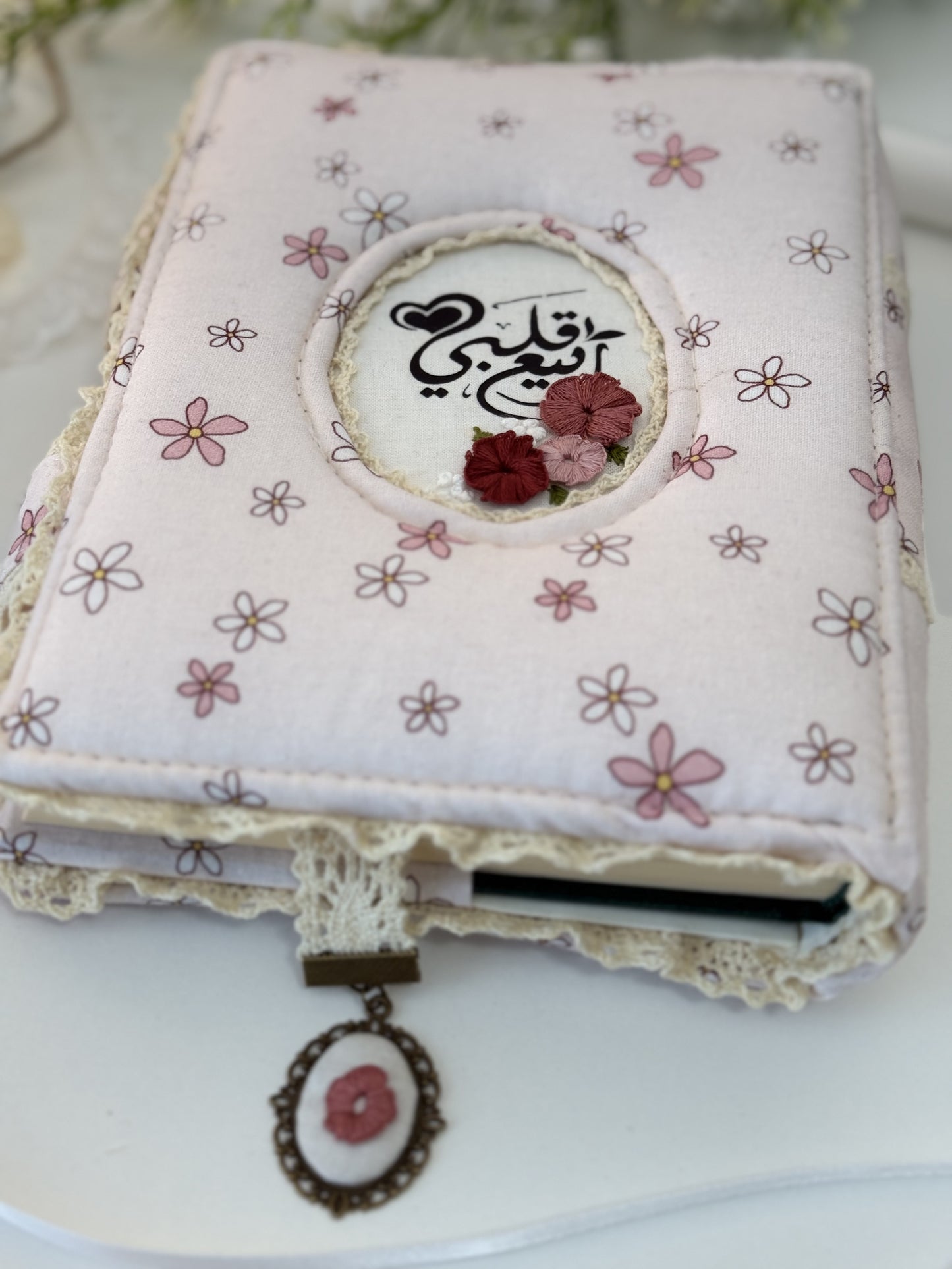 light pink floral hardcover Qurān cover